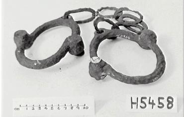The rusted leg irons may have been similar to this set in the Powerhouse Museum Collection.